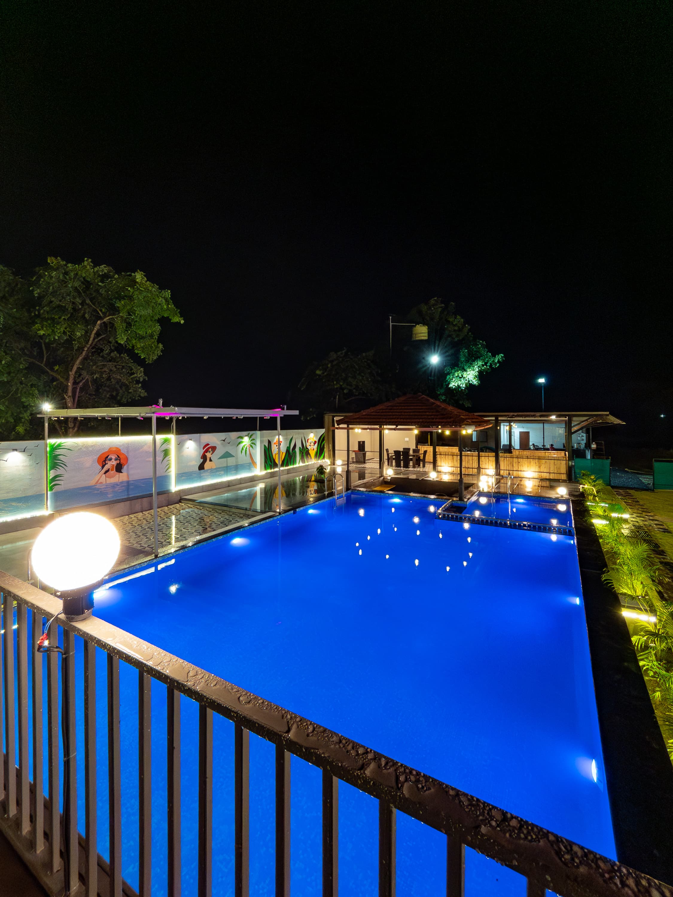 Private pool lit at night